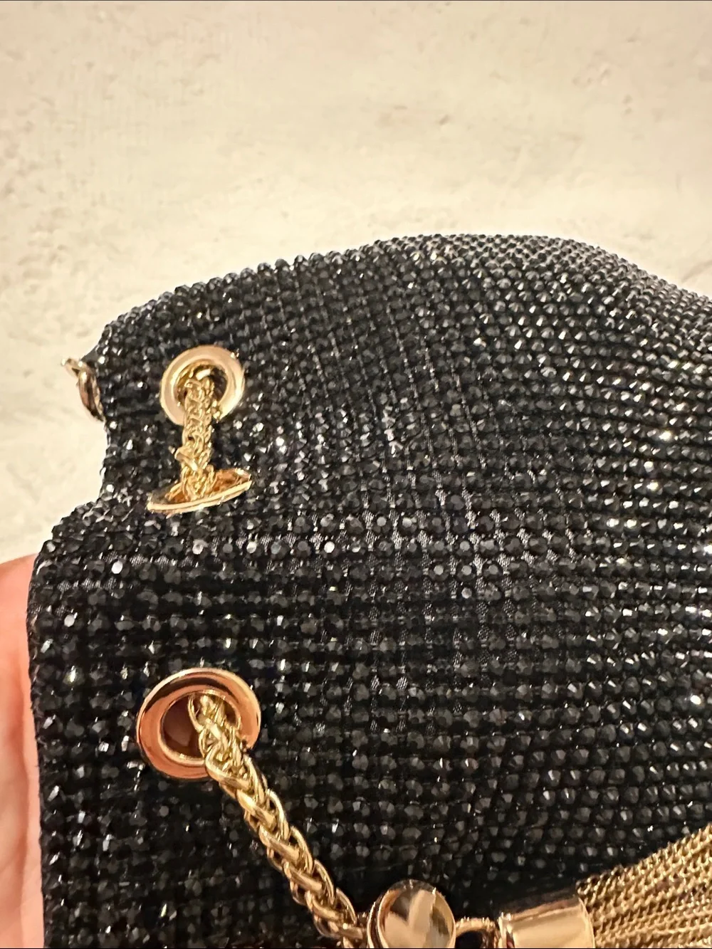 Olga Berg Black Beaded Crossbody Bucket Bag with Gold Chain & Tassels
